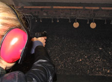 Heather Bosch shooting a gun