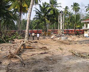 A passenger train is destroyed by the powerful waves of a tsunami in 2004