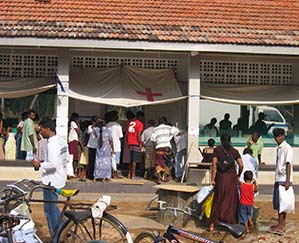 A village in Sri Lanka. This aid station has been lining up for blocks.