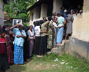 Food and supplies await these survivors of the 2004 tsunami in Sri Lanka.