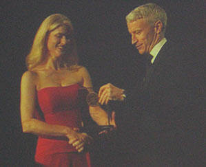 Anderson Cooper presenting Heather Bosch with a national Edward R. Murrow Award