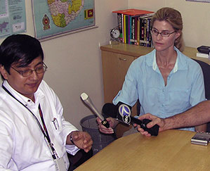 Heather Bosch interviewing the executive of World Vision while covering the tsunami aftermath in Sri Lanka