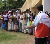 tsunami victims line up for aid from World Vision