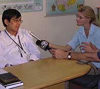 Heather Bosch is shown interviewing a World Vision leader who is coordinating the relief for tsunami victims